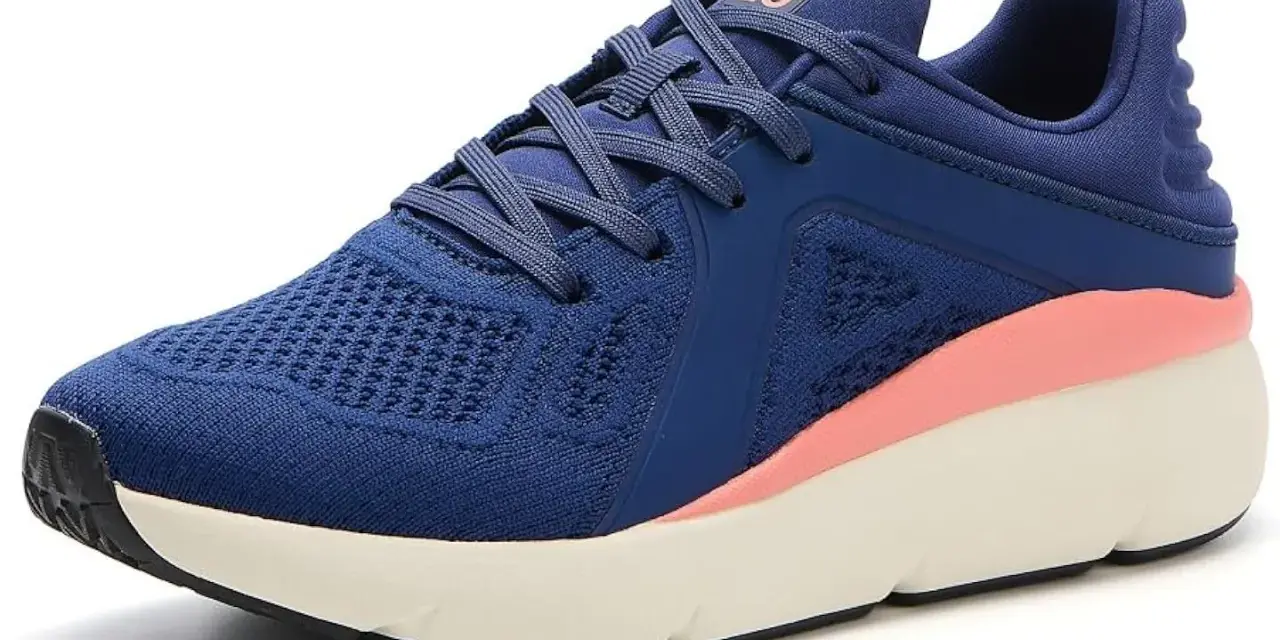 Zapatilla deportiva azul con detalles rosados, ideal como calzado para metatarsalgia, ofreciendo comodidad y soporte.