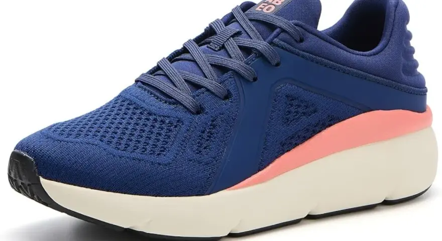 Zapatilla deportiva azul con detalles rosados, ideal como calzado para metatarsalgia, ofreciendo comodidad y soporte.
